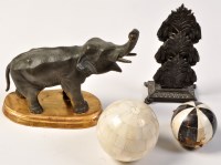 Lot 815 - A patinated metal model of an elephant, with...