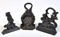 Lot 818 - Three 19th Century black painted cast iron...