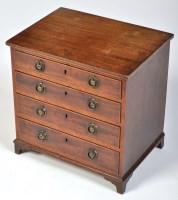 Lot 831 - A miniature George III style chest of four...