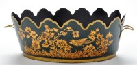 Lot 835 - A late 19th/early 20th Century green Toleware...