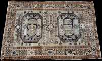 Lot 873 - An early 20th Century Caucasian rug, the ivory...