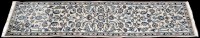 Lot 876 - A Nain runner, decorated with floral scrolls...