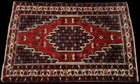 Lot 882 - A Mazlegan rug, the geometric medallion...