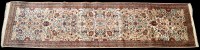 Lot 890 - An Indo-Persian runner, the ivory field...