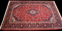 Lot 899 - A Kashan carpet, the central floral medallion...