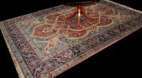 Lot 901 - A Kirman carpet, the shaped field and central...