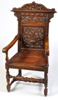 Lot 944 - A 19th Century carved oak hall chair, the...