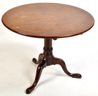 Lot 992 - A George III circular mahogany tip-up-top...