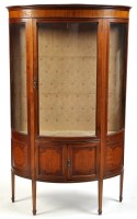 Lot 997 - An Edwardian inlaid mahogany bowfront display...