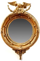 Lot 1007 - *A Regency giltwood convex wall mirror, the...