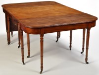 Lot 1012 - *A Regency mahogany dining table, central drop-...