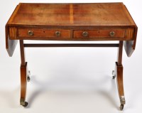 Lot 1021 - *A Regency mahogany sofa table, the panel top...