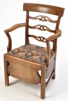 Lot 1037 - *A late Georgian mahogany open arm commode...