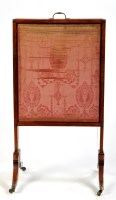 Lot 1052 - *A 19th Century mahogany firescreen, with...