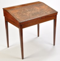 Lot 1063 - *A late Georgian mahogany desk, with hinged...