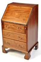 Lot 1080 - An Edwardian inlaid mahogany bureau, decorated...