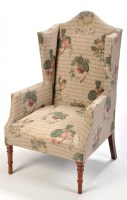 Lot 1081 - A wing easy chair, upholstered in fruit...