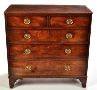 Lot 1083 - A George III mahogany chest of two short and...