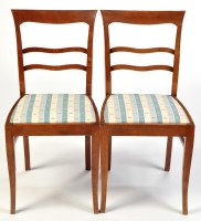 Lot 1085 - A pair of stained beech Biedermeier style...