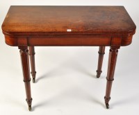 Lot 1105 - A George III mahogany turnover swivel top card...