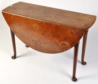 Lot 1116 - *A George III mahogany drop leaf dining table,...