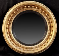 Lot 1117 - *A Regency giltwood convex wall mirror, the...