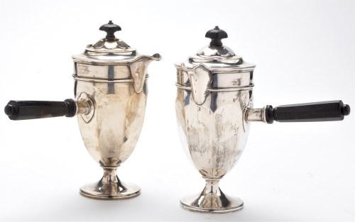 Lot 556 - A pair of George V cafe au lait pots, by...