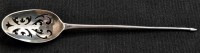Lot 594 - A Georgian silver mote spoon, rubbed marks.