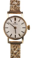 Lot 686 - Omega: a lady's 9ct. gold cased wristwatch,...