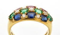 Lot 715 - A ruby, emerald, sapphire and diamond ring,...