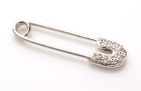 Lot 717 - A diamond and 18ct. white gold safety pin...