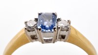 Lot 722 - A tanzanite and diamond ring, the emerald-cut...