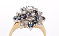 Lot 728 - A sapphire and diamond dress ring, the...