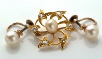 Lot 732 - A diamond and pearl set brooch, of fan design...