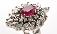 Lot 740 - A ruby and diamond ring, the central oval...