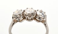 Lot 747 - A three stone diamond ring, the brilliant cut...