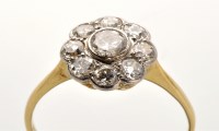 Lot 751 - A diamond cluster ring, the transitional...