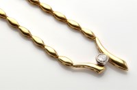 Lot 755 - A diamond set yellow metal necklace, the...