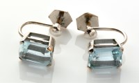 Lot 762 - A pair of aquamarine earrings, the emerald-cut...
