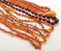 Lot 772 - An amber necklace of graduated beads with pear-...