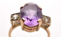 Lot 774 - An amethyst and diamond ring, the oval facet...