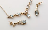 Lot 775 - A topaz and diamond pendant, set with five...