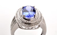 Lot 778 - A tanzanite and diamond cluster ring, the...