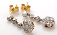 Lot 783 - A pair of diamond drop earrings, each with...