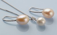 Lot 790 - A cultured pearl drop pendant, on diamond set...