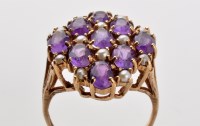 Lot 794 - An amethyst and cultured pearl dress ring, the...