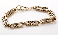 Lot 798 - A Victorian yellow metal bracelet, of pierced...