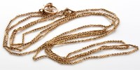 Lot 801 - An early 20th Century yellow metal muff chain...