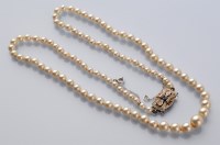 Lot 813 - A cultured pearl necklace, the graduated...