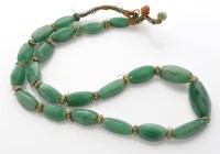 Lot 822 - A 19th Century jadeite graduated bead necklace,...